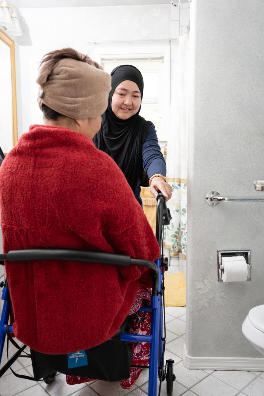 caregiver helping client after showering.