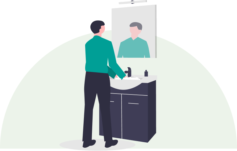 person washing hands at a sink.