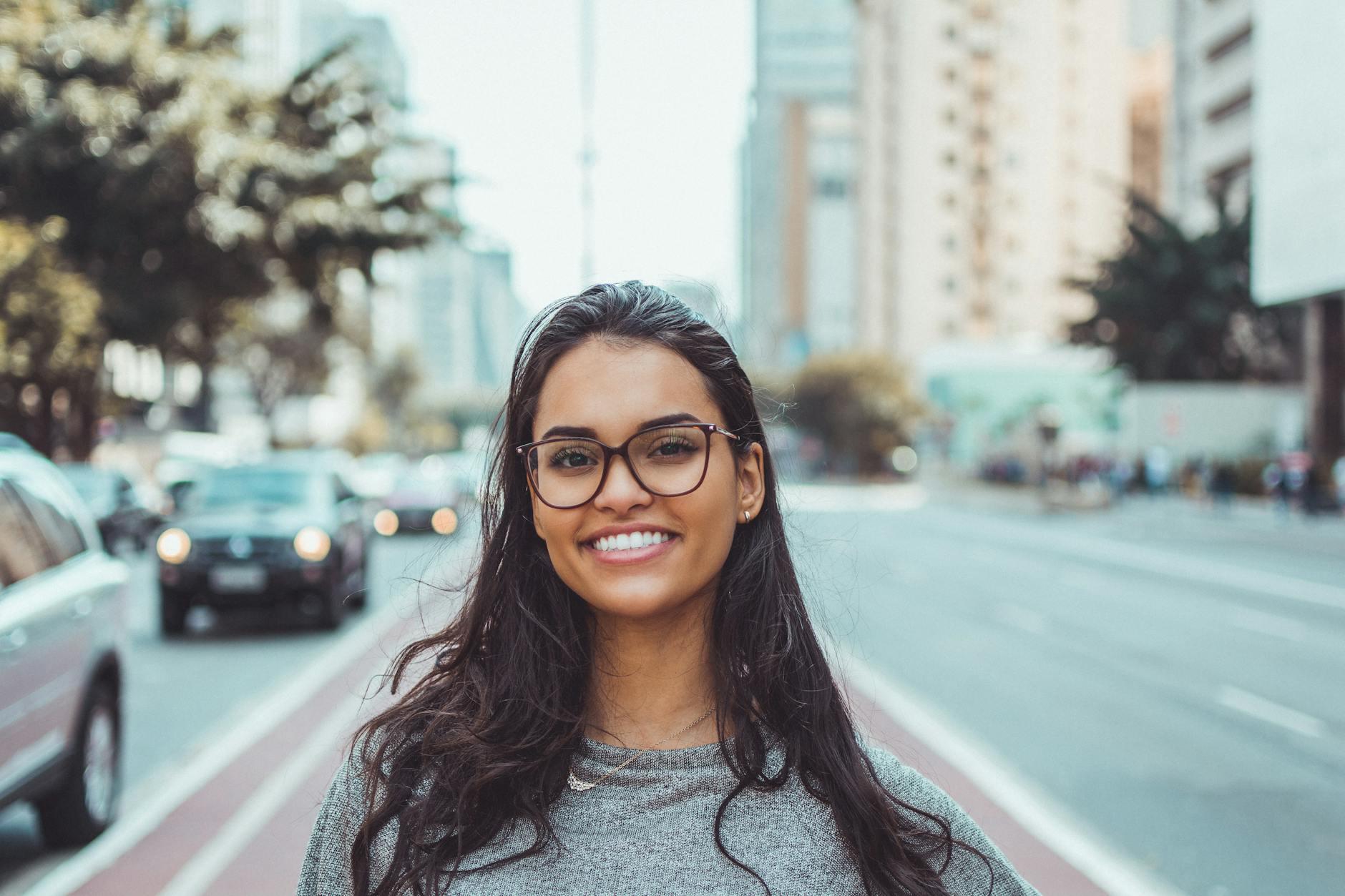 A young woman standing in the street